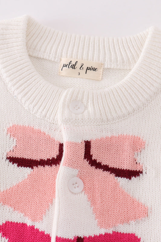 Girls’ White Knit Cardigan with Colorful Bow Design