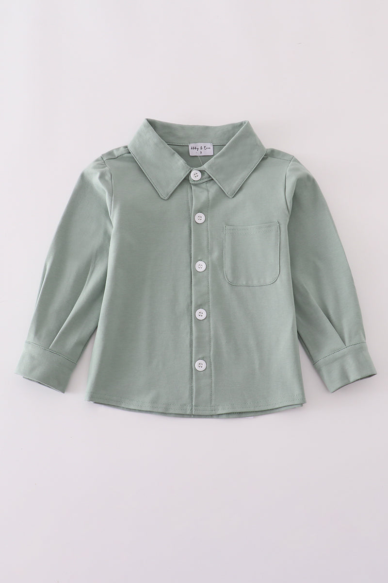 Green button-up shirt on a light gray background