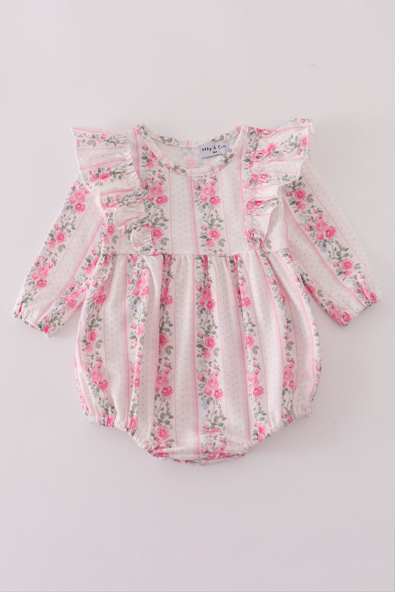 Floral baby romper on a light gray background
