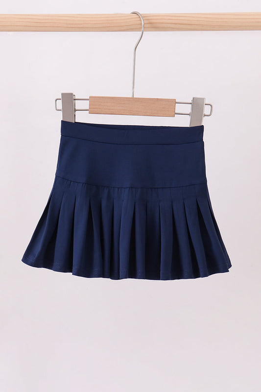 Classic navy pleated skort for girls with built-in shorts. Comfortable, polished, and perfect for school, play, and everyday wear.
