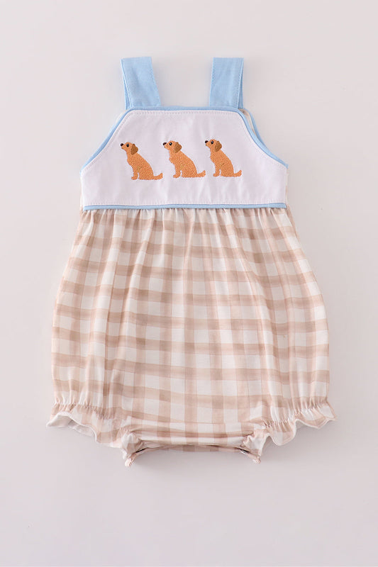 Baby romper with checkered pattern and embroidered dogs on a light gray background
