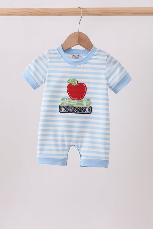 A baby short-sleeve romper with light blue and white horizontal stripes, featuring a red apple and green plaid stack applique on the chest, hanging on a wooden hanger.