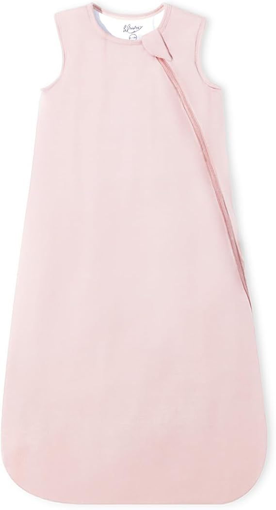 A light pink sleeveless baby sleep sack with a diagonal zipper, photographed flat against a white background.