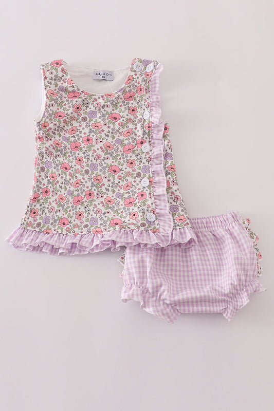 Floral sleeveless top and checkered shorts set on a light gray background