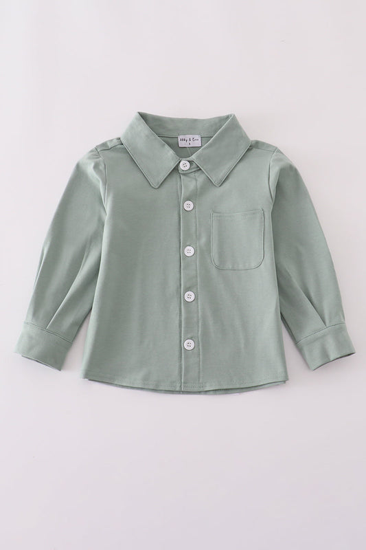 Green button-up shirt on a light gray background