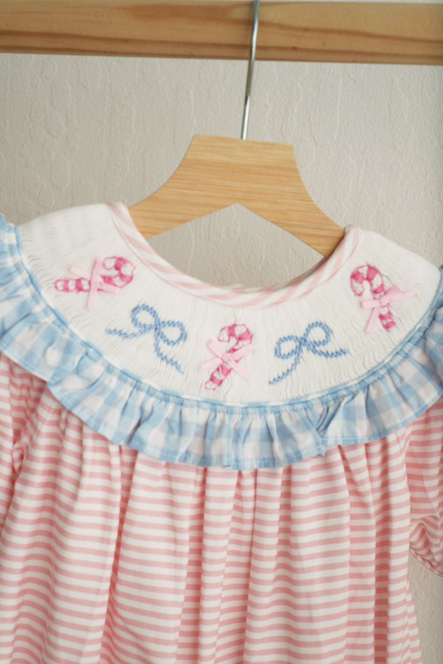 Pink Candy Cane Bow Hand-Smocked Ruffle Romper