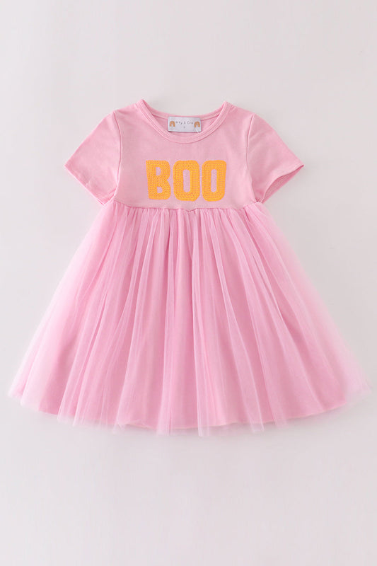 Pink short sleeve dress with orange boo and skirt