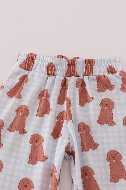 Pajama pants with red dog pattern on a light background