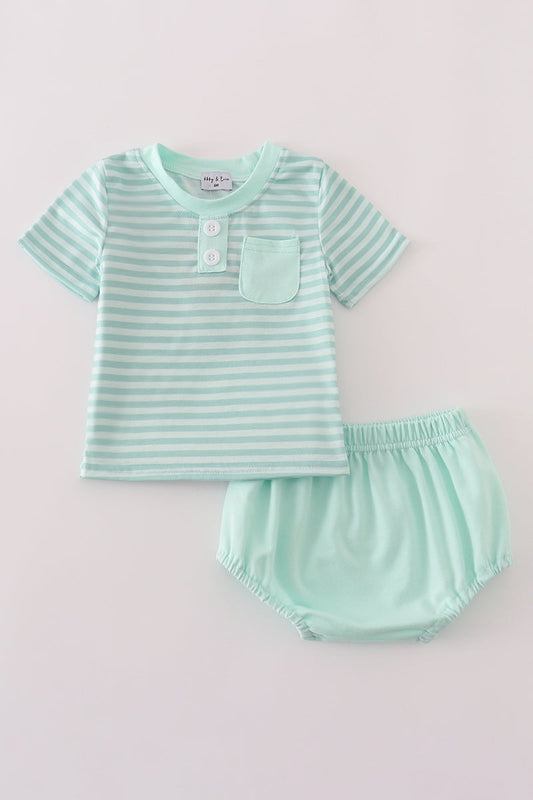 Mint green striped shirt and diaper set on a light gray background