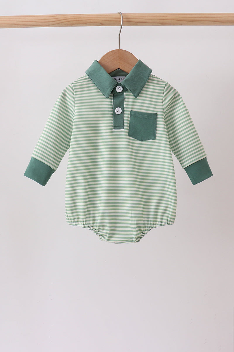 A baby long-sleeve romper with light green and white horizontal stripes, featuring a solid green collar, button placket, chest pocket, and green cuffs, hanging on a wooden hanger.