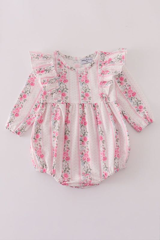 Floral baby romper on a light gray background