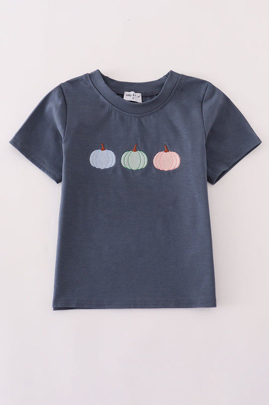 Navy blue t-shirt with embroidered pumpkins on a light gray background