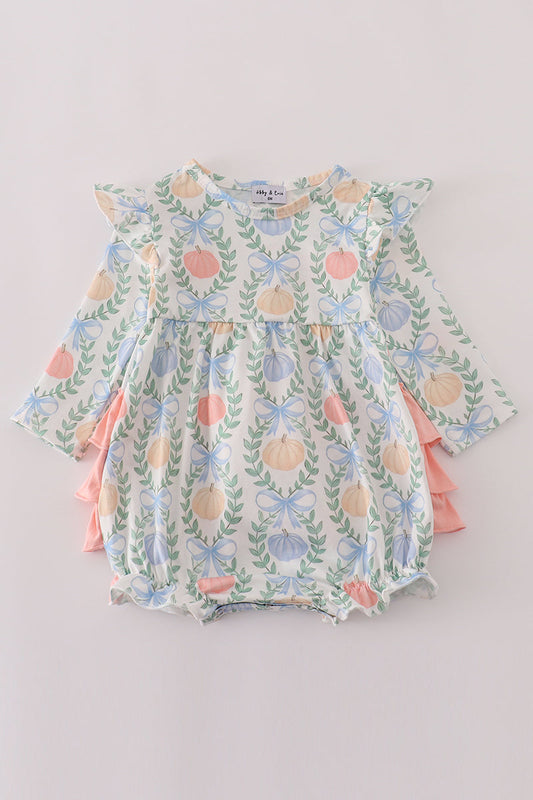 Floral-patterned baby romper on a light gray background